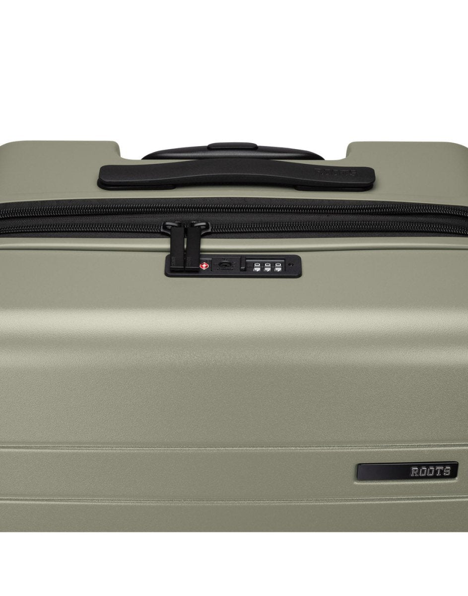 Roots Travel 24" Expandable Hardside Spinner in sage, close-up view of integrated TSA lock and self repairing zipper.