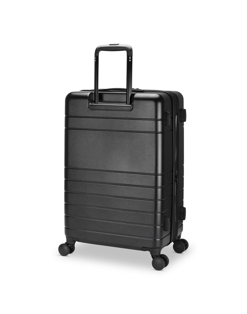 Roots Travel 24" Expandable Hardside Spinner in black, back angle view with handle extended out.