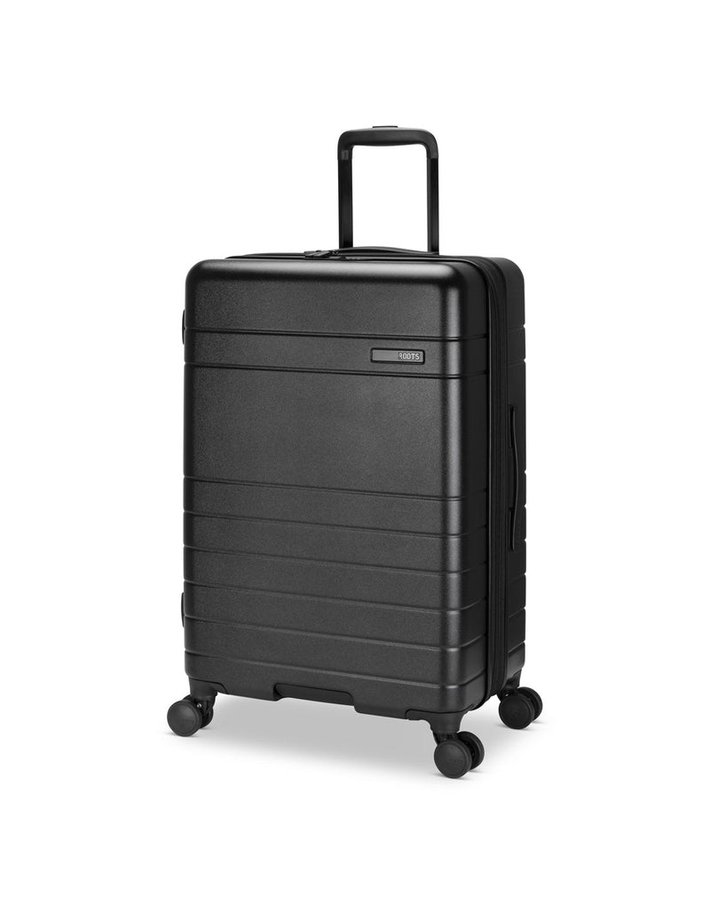 Roots Travel 24" Expandable Hardside Spinner in black, front angle view.