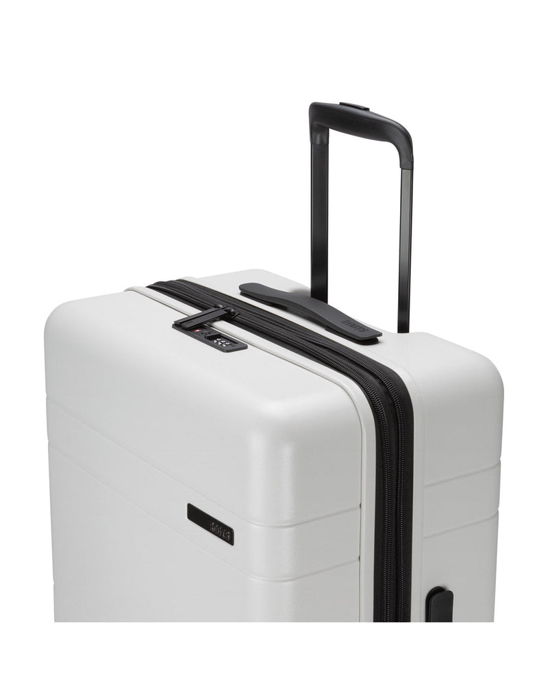 Roots Travel 24" Expandable Hardside Spinner in antarctica, close-up view of extended luggage handle.
