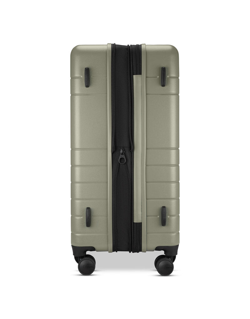 Roots Travel 24" Expandable Hardside Spinner in sage, expanded side view.