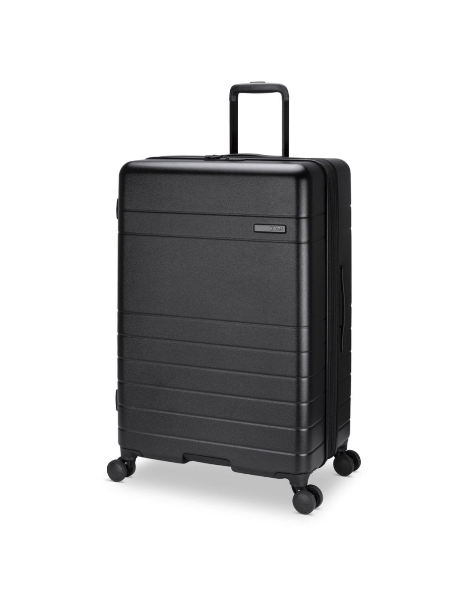 Roots Travel 28" Expandable Hardside Spinner in black, front angle view.