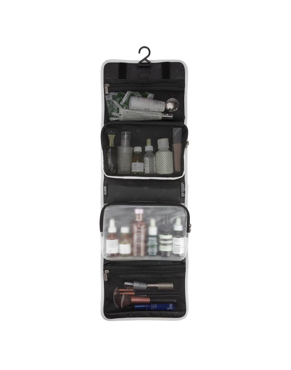 Front view of Roots Travel Toiletry Bag in antarctica, unfolded with items placed inside interior pockets.