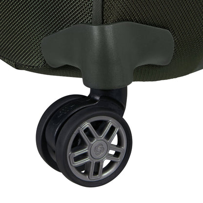 Close-up of a black dual-wheel caster on the Samsonite Re-Lite Spinner Carry-On™ textured dark green luggage.
