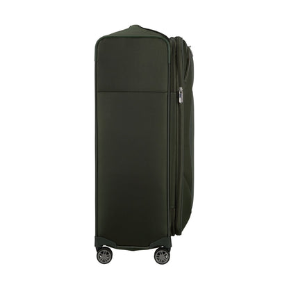 The Samsonite Re-Lite Spinner Large, a dark green eco-friendly suitcase, stands upright on a white background.