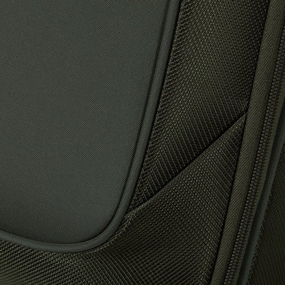 Close-up of green textured fabric, seams, and zipper on a Samsonite Re-Lite Spinner Medium luggage.