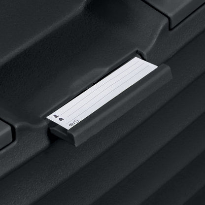 A close-up of the Samsonite Upscape Spinner Carry-On™ label in a black holder, ideal for lightweight travel.