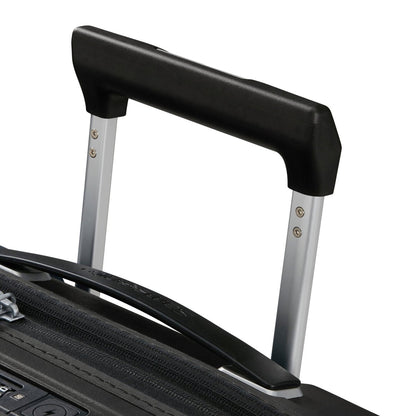 Close-up of the extended telescopic handle on the Samsonite Upscape Spinner Carry-On™ sleek black suitcase.