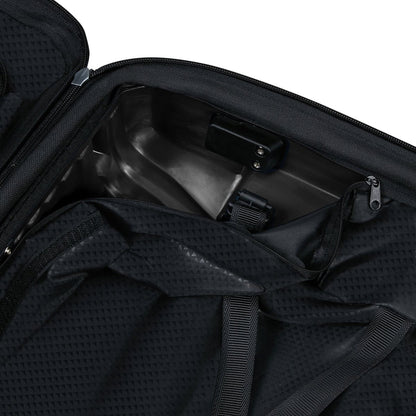 The Samsonite Upscape Spinner Carry-On™ in black open to show fabric lining, straps, and a metal compartment.