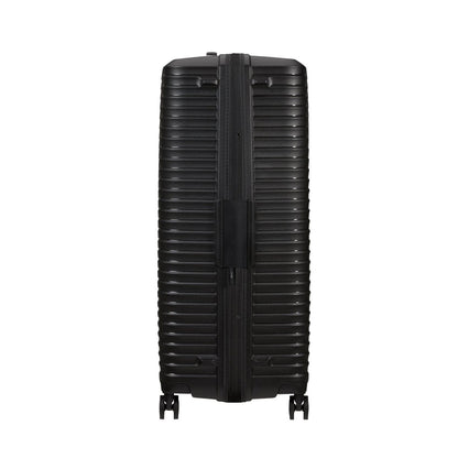 Samsonite Upscape Spinner Large—black, hard-shell suitcase with shock-absorbing wheels and horizontal ridges.