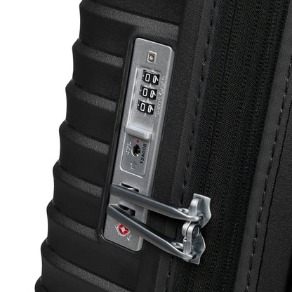 Close-up of the Samsonite Upscape Spinner Medium, a lightweight black suitcase with TSA lock and metal zipper pulls.