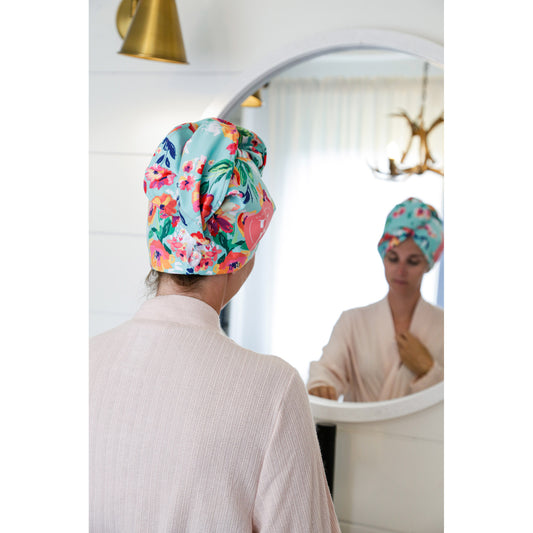 Product Image – A person in a light robe uses the K5 Microfibre Hair Towel while looking at their reflection.