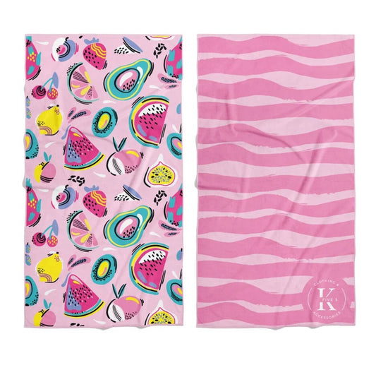 Product Image – Two pink K5 Microfibre Beach Towels: one with colorful fruit, one with wavy stripes and K5 logo.