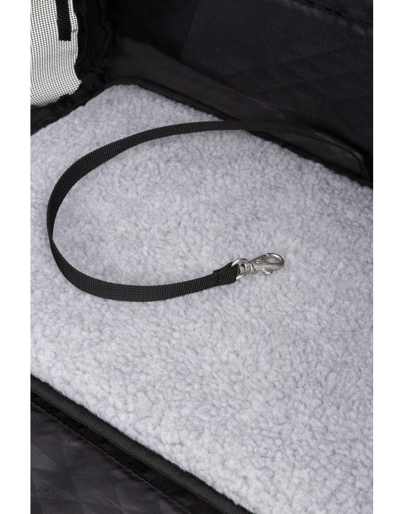 Close up of interior view of fuzzy bottom mat and attached pet clip