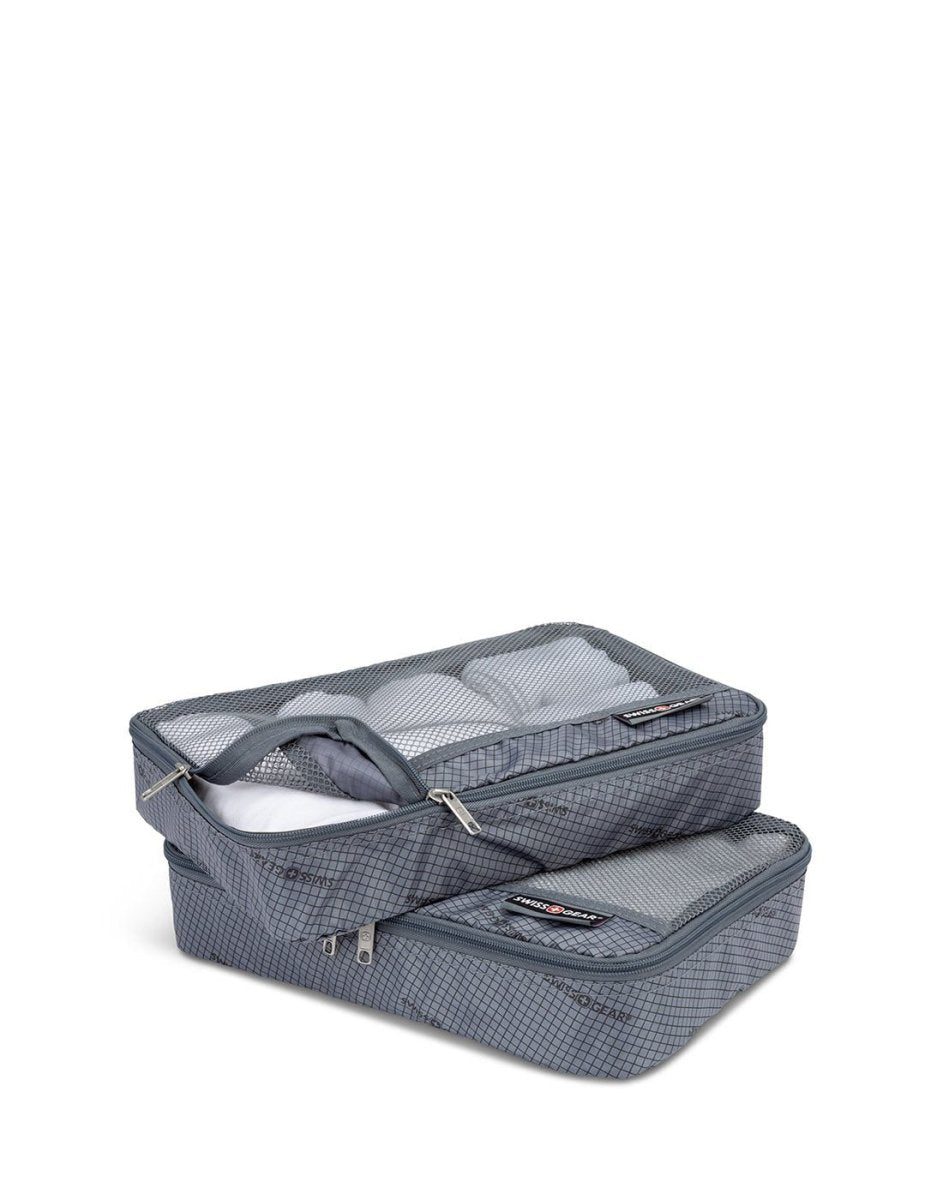 Two grey packing cubes with mesh tops, stacked with clothes packed inside each