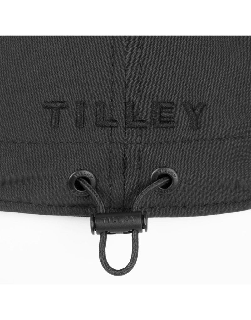 Close up of black Tilley Airflo Cap back adjustment cord with Tilley logo embroidered above
