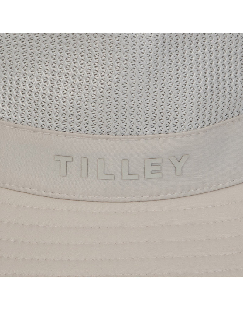 Close up of Tilley logo and ventilation panel on crown of Tilley LTM1 Airflo® Bucket in light stone