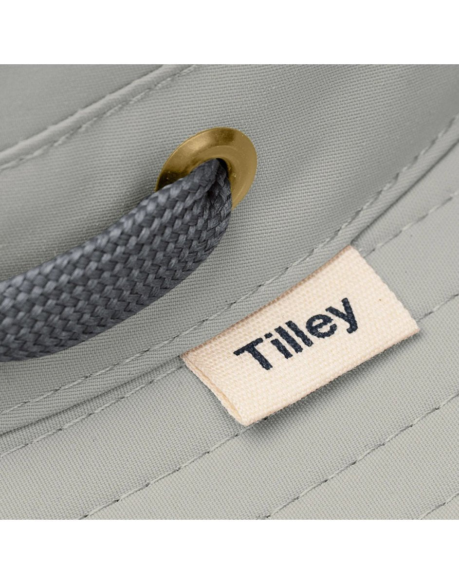 Close up of tag on brim of Tilley LTM6 AIRFLO® Hat in rockface, grey colour