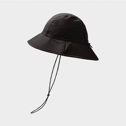 Tilley Storm Bucket Hat in black, side view with windcord dangling down