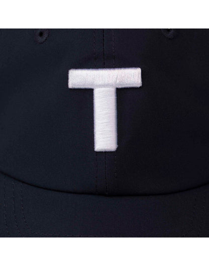 Close up of large white stitched T on dark navy Tilley T Golf Cap