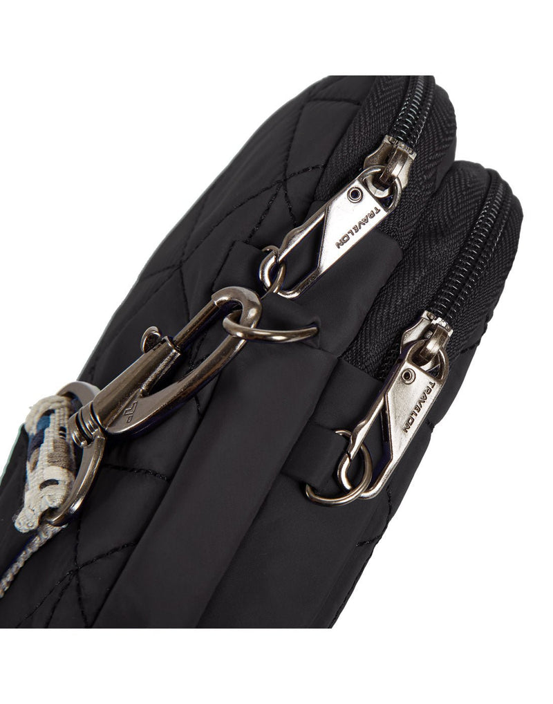 Close up of lockable zipper pulls on both compartments of black Travelon Boho Anti-Theft 2 Compartment Phone Crossbody