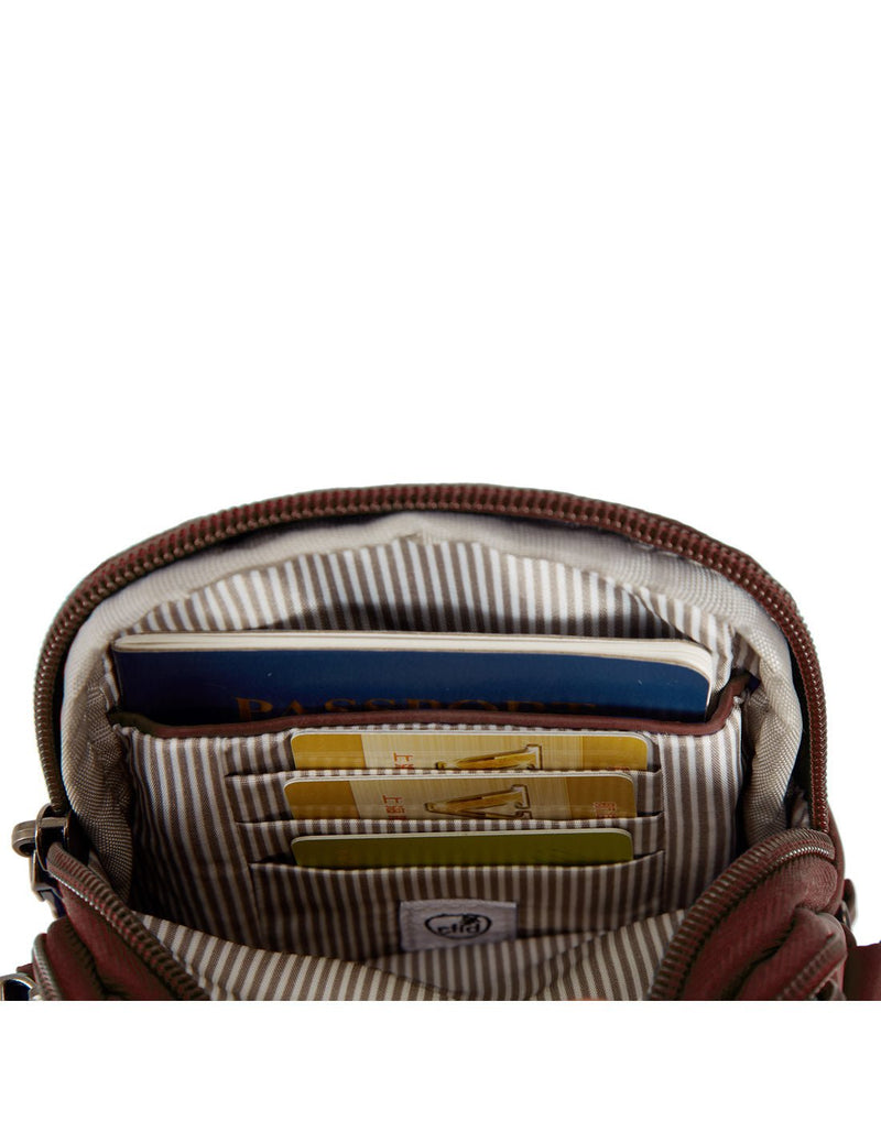 Close up of RFID passport slip pocket and 3 credit card slots on interior of bag