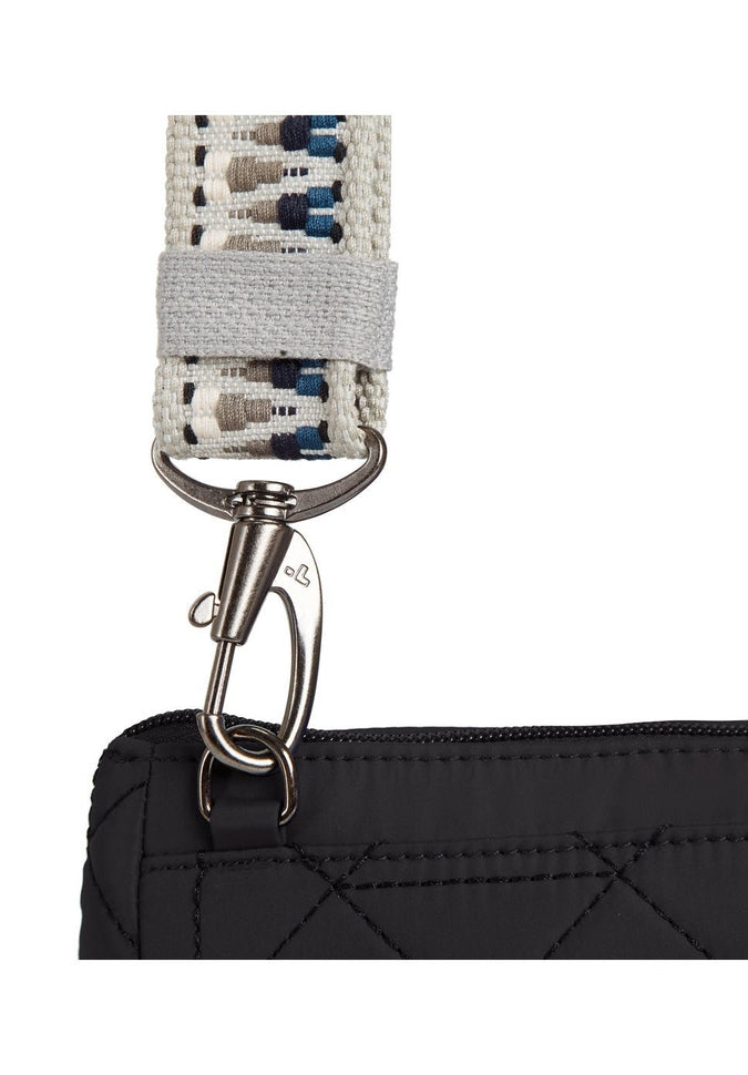 Close up of detachable woven tan guitar strap style crossbody strap on black bag