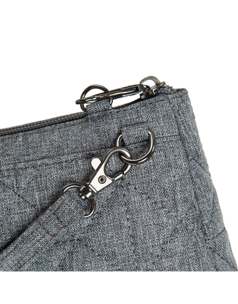Close-up view of the lock-down strap for the Travelon Boho Anti-Theft Clutch Crossbody in Grey.