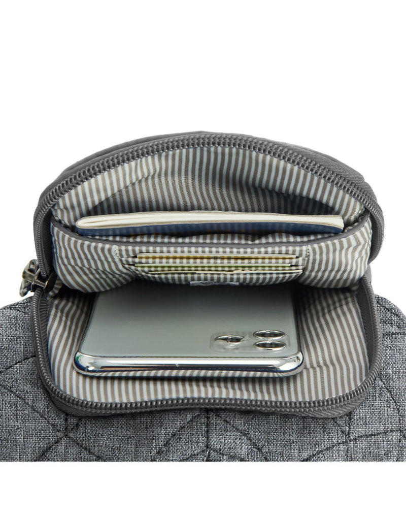 Travelon Boho Anti-Theft Insulated Water Bottle Tote in grey, close up of front pocket unzipped with passport, 3 credit cards and cell phone inside