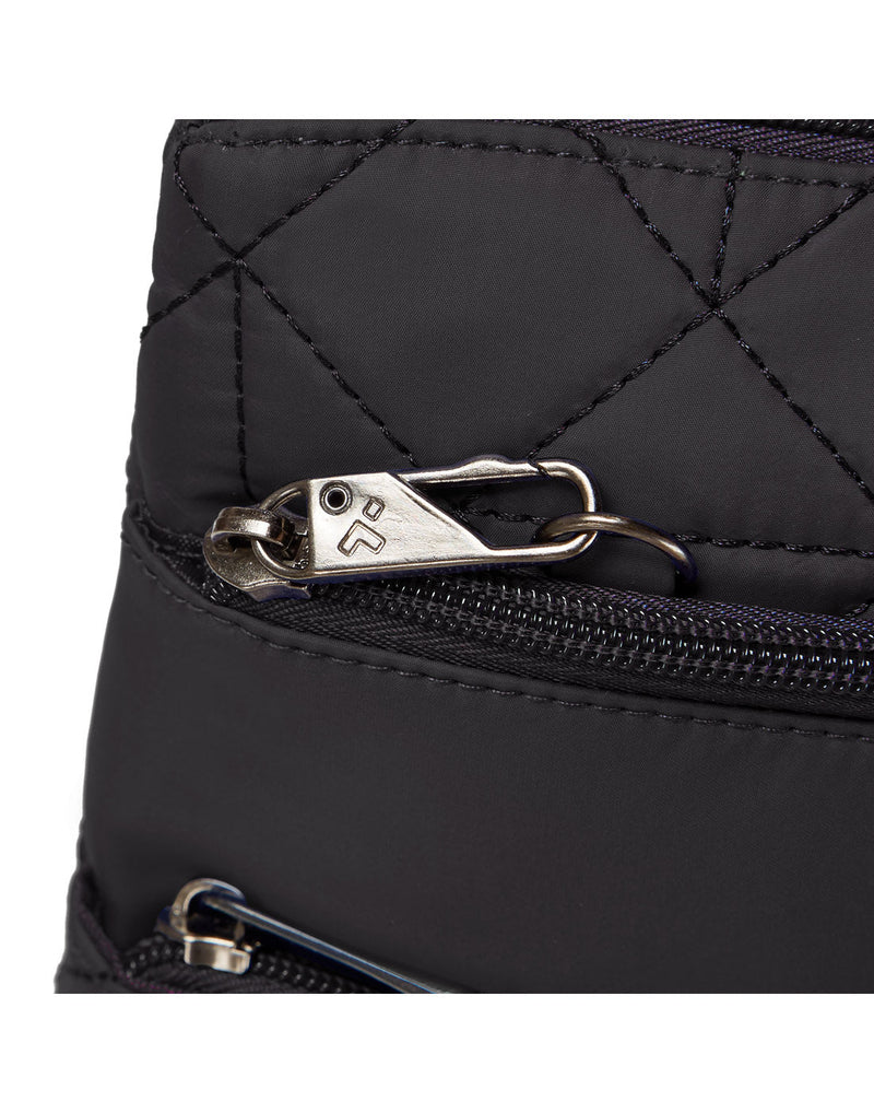 Close-up view of the Travelon Boho Anti-Theft Slim Crossbody's Anti-Theft security system for the exterior zipper.