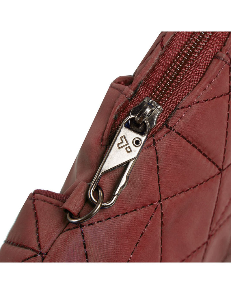Close-up view of the Travelon Boho Anti-Theft Slim Crossbody's Anti-Theft security system  for the exterior zipper.