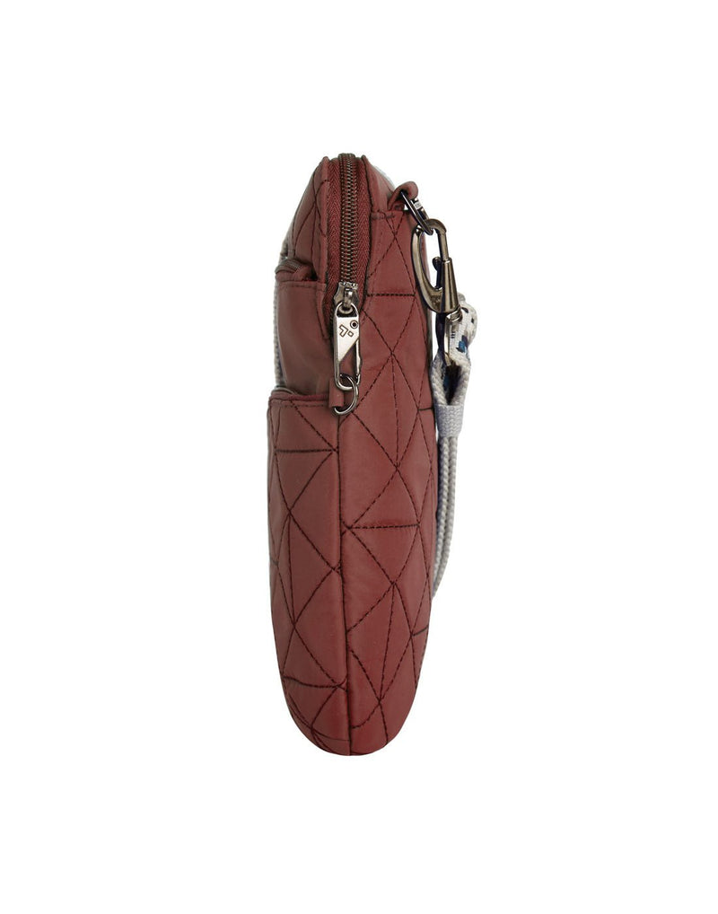 Side view of the Travelon Boho Anti-Theft Slim Crossbody in Paprika showing the  exterior security zipper and strap.