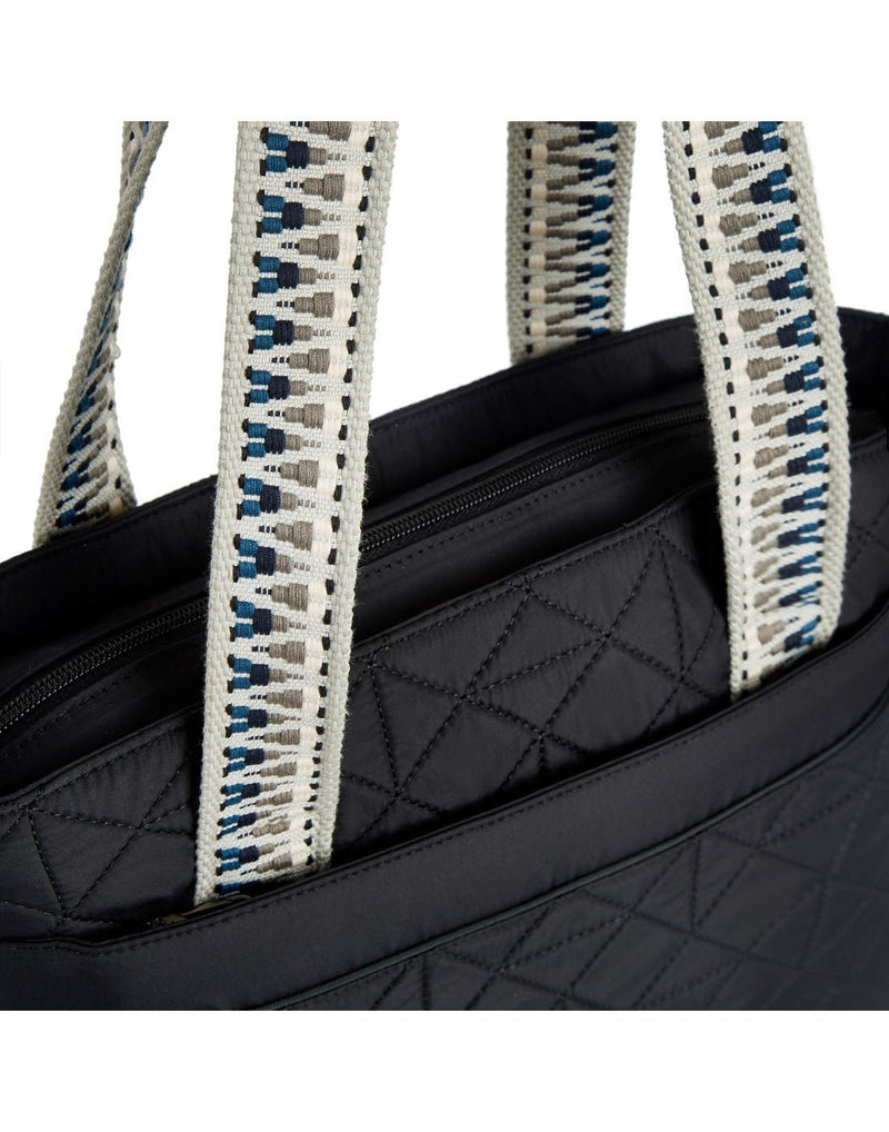 Close-up view of the Travelon Boho Anti-Theft Tote in Black, showing the carry handles sewn into front and back panels.