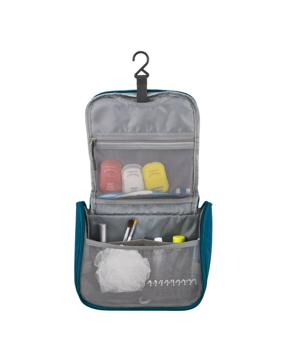 Front view of Travelon World Travel Essentials Toiletry Bag in peacock teal, unzipped with items stored inside interior storage compartments.