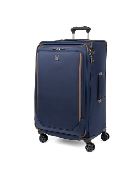 Product Image – Travelpro Crew™ Classic Large Check-in Expandable Spinner in Patriot Blue, front and partial left-side view.