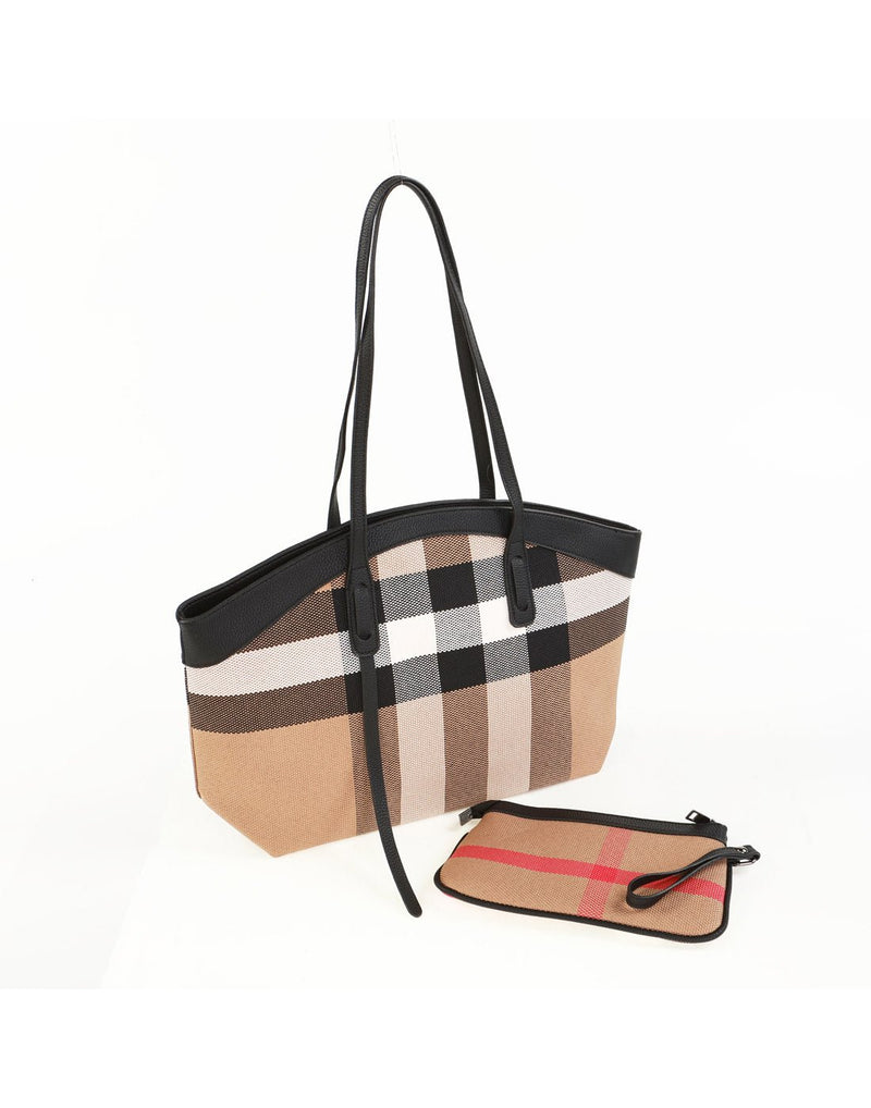 Alina's 2pc Rounded Handbag in white, black, tan and red chunky plaid with tan faux leather rounded edging on top and matching double strap. Beside it is a small matching zippered pouch, side angled view.