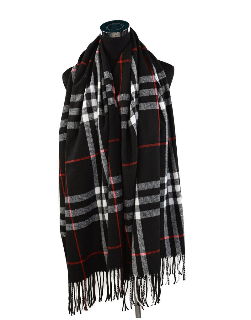 Alina's Plaid Scarf in black with white and red, hanging on a mannequin