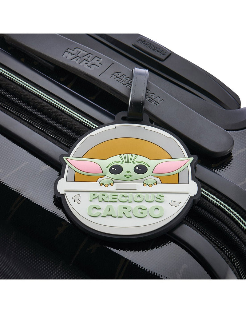 American Tourister Star Wars - The Child Luggage Tag affixed to a black suitcase handle