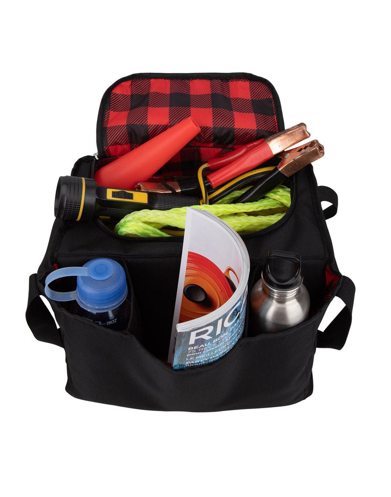 Austin House Car Organizer open to show red and black plaid lining and filled with car gear (jumper cables, road signal, rope, flashlight, magazine and water bottles)