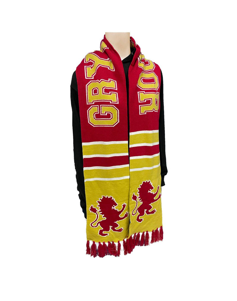 Red and yellow Gryffindor team scarf with red tassels and lion symbol; hanging on manequin