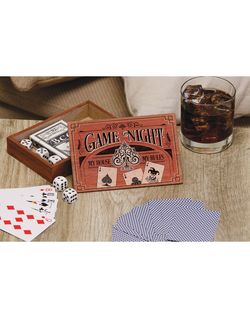 Lifestyle image of Carson Game Night Cards with Dice Set on a table with cards and dice out and lid of box open and a drink beside