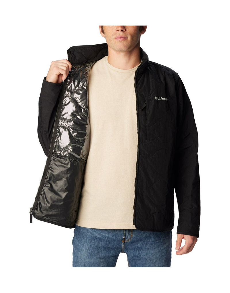 Front view of a man wearing the Columbia Men's Birchwood™ Jacket in black. Unzipped and showing the inside reflective lining.