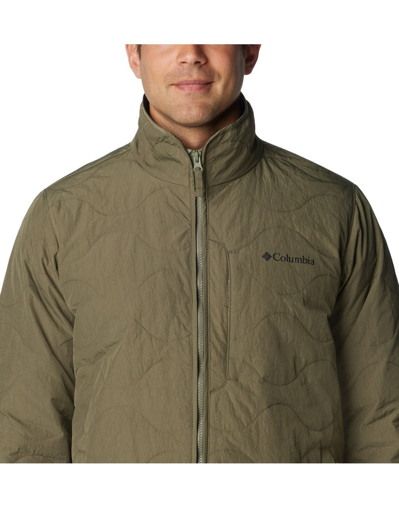 Close-up front view of a man wearing the Columbia Men's Birchwood™ Jacket in Stone Green colour.