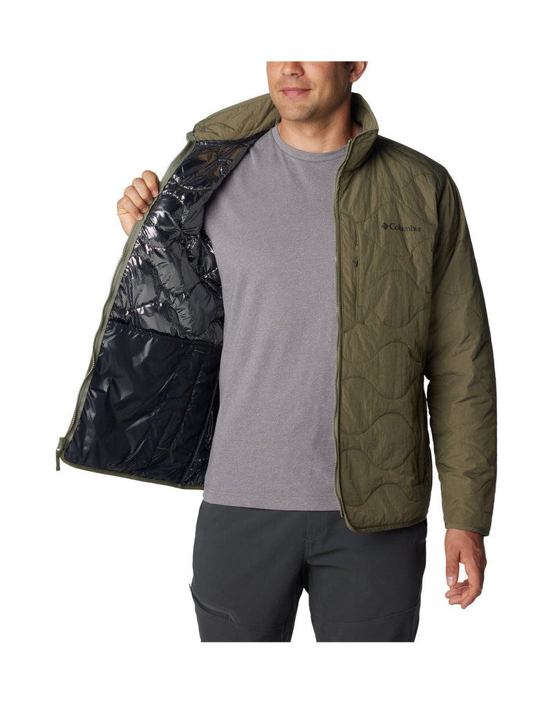 Front view of a man wearing the Columbia Men's Birchwood™ Jacket in Stone Green. Unzipped and showing the inside reflective lining.