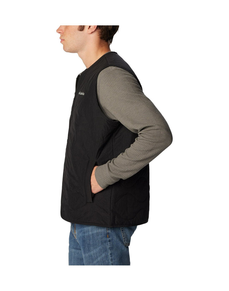 Left side view of a man wearing the Columbia Men's Birchwood™ Vest in black colour.