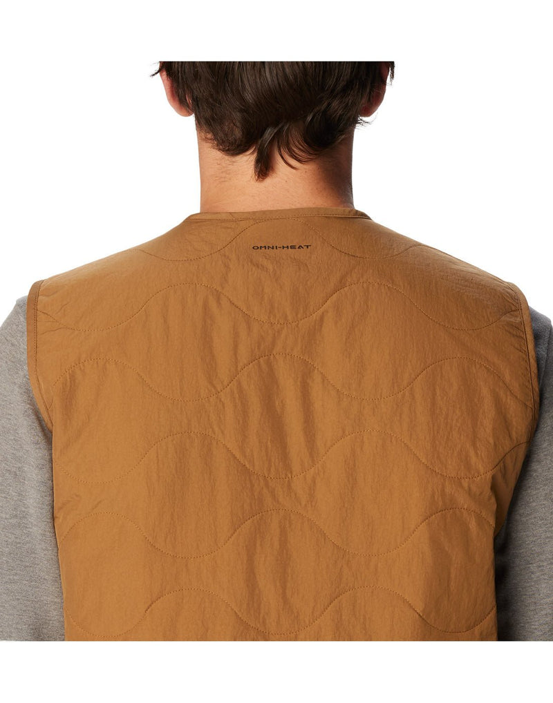 Close-up back view of a man wearing the Columbia Men's Birchwood™ Vest in Delta brown colour.