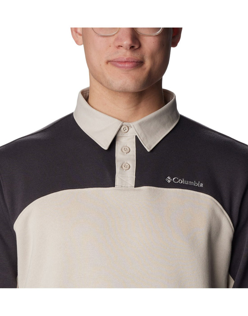 Close-up front view of a man wearing the Columbia Men's Columbia Trek™ Long Sleeve Rugby Shirt in Shark Dark Stone colour.