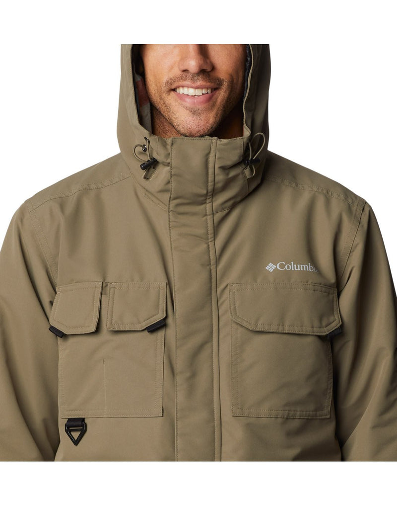 Close-up front view of a man wearing the Columbia Men's Landroamer™ Lined Jacket in Stone Green colour with Hood up.