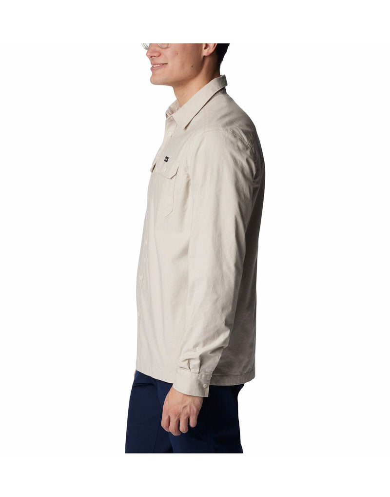 Left side view of a man wearing the Columbia Men's Landroamer™ Lined Shirt in Dark Stone colour.