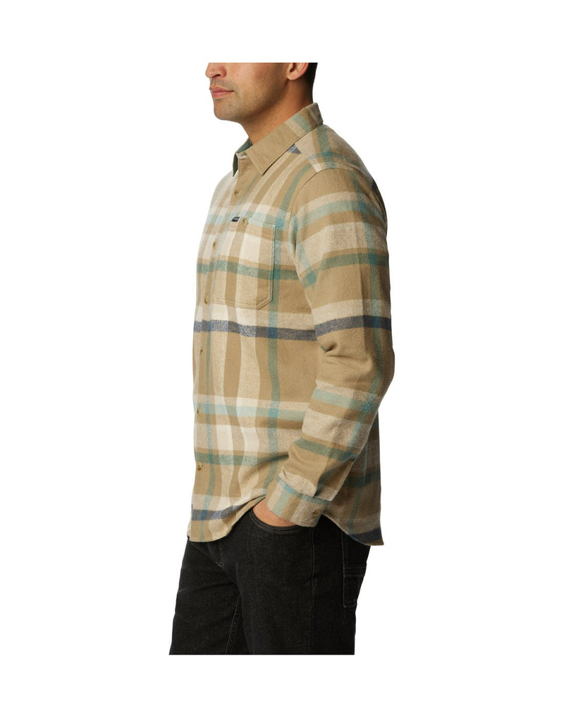 Left side view of a man wearing Columbia Men's Pitchstone™ Heavyweight Flannel Shirt in "Dark Stone Macro Multi" colour.